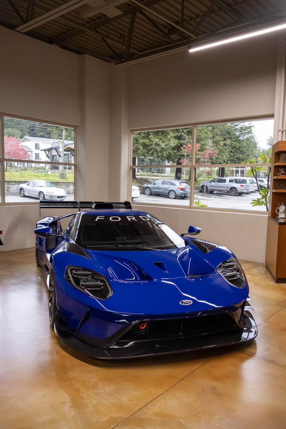 Blue Ford GT on a polished showroom floor